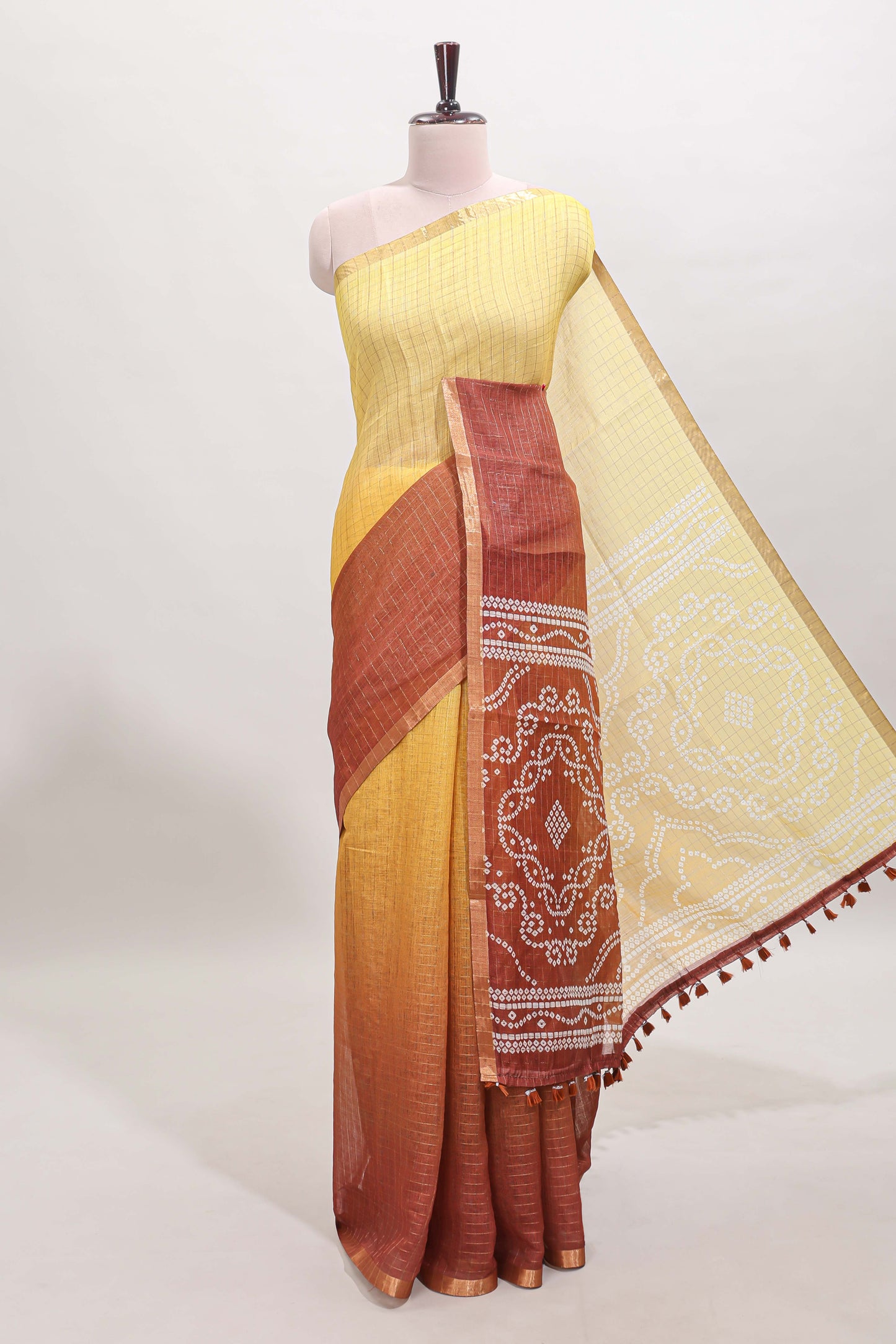 Yellow and brown dual shade checked checked linen cotton saree with self zari border printed blouse