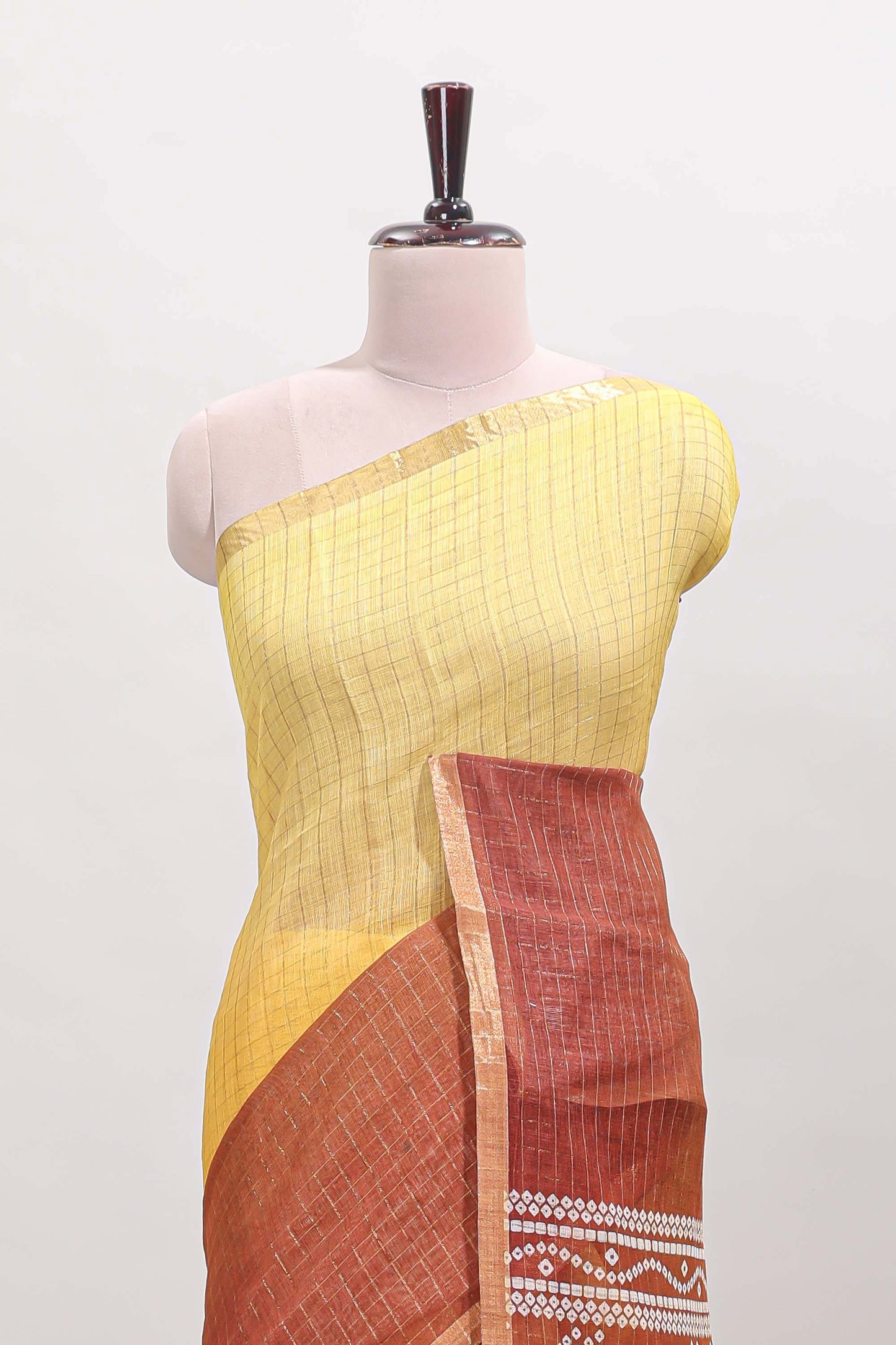 Yellow and brown dual shade checked checked linen cotton saree with self zari border printed blouse