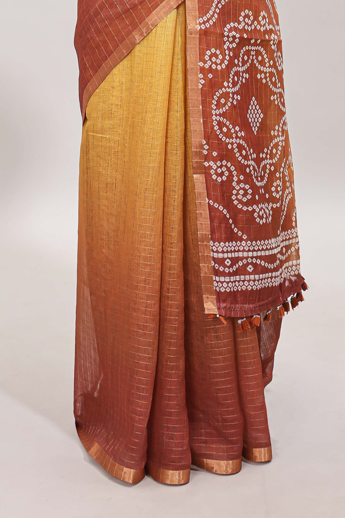 Yellow and brown dual shade checked checked linen cotton saree with self zari border printed blouse