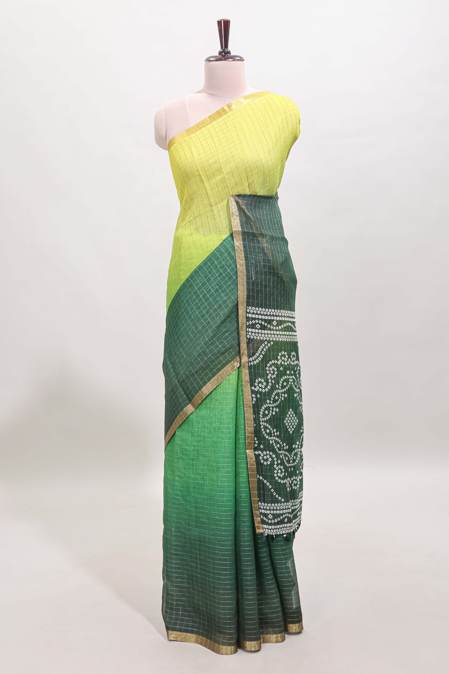 Yellow and green dual shade checked linen cotton saree with self zari border and matching blouse