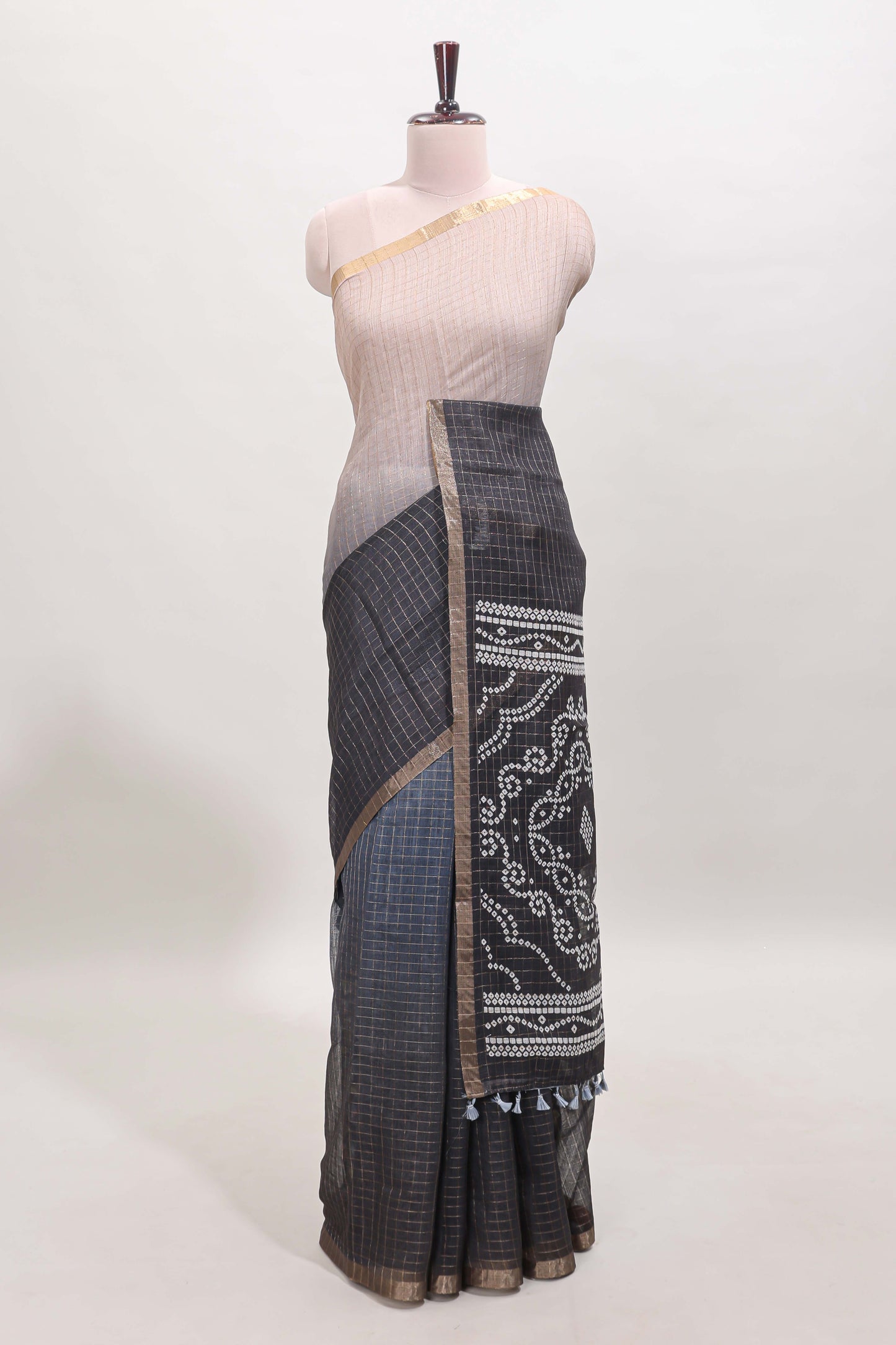 Cream and black dual shade checked checked linen cotton saree with self zari border printed blouse