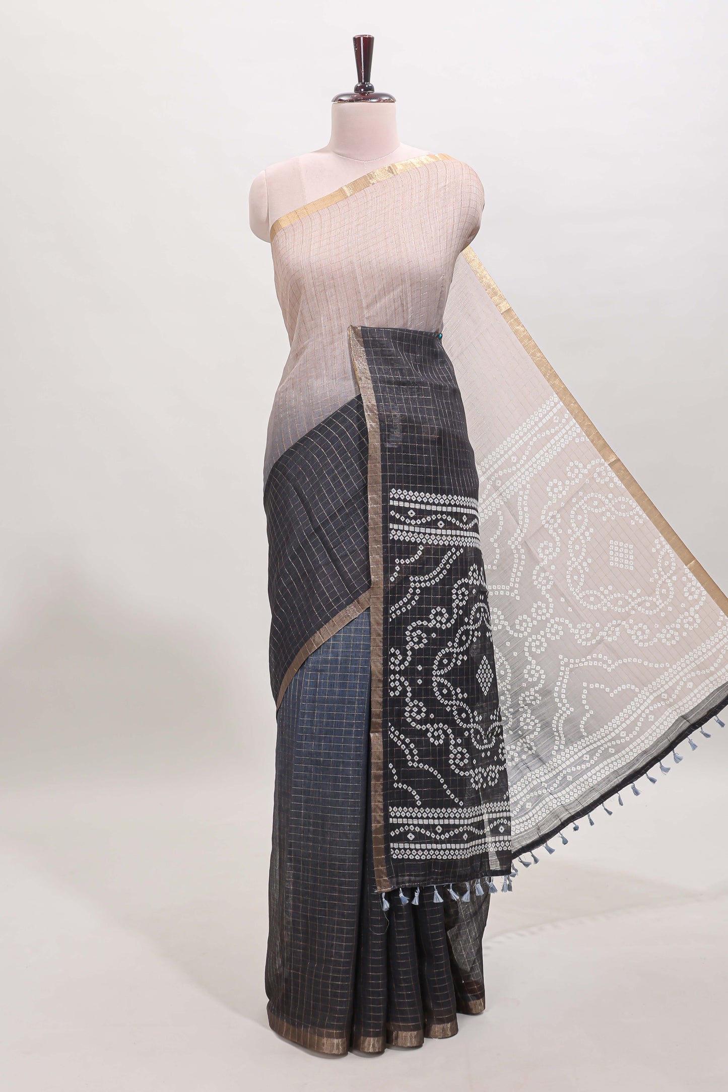 Cream and black dual shade checked checked linen cotton saree with self zari border printed blouse