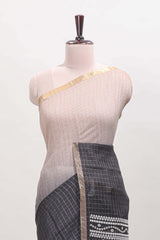 Cream and black dual shade checked checked linen cotton saree with self zari border printed blouse