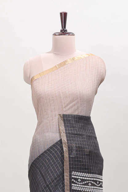 Cream and black dual shade checked checked linen cotton saree with self zari border printed blouse