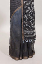 Cream and black dual shade checked checked linen cotton saree with self zari border printed blouse