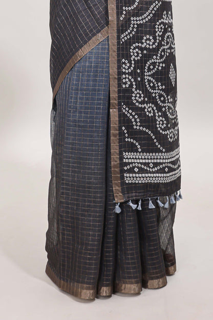 Cream and black dual shade checked checked linen cotton saree with self zari border printed blouse