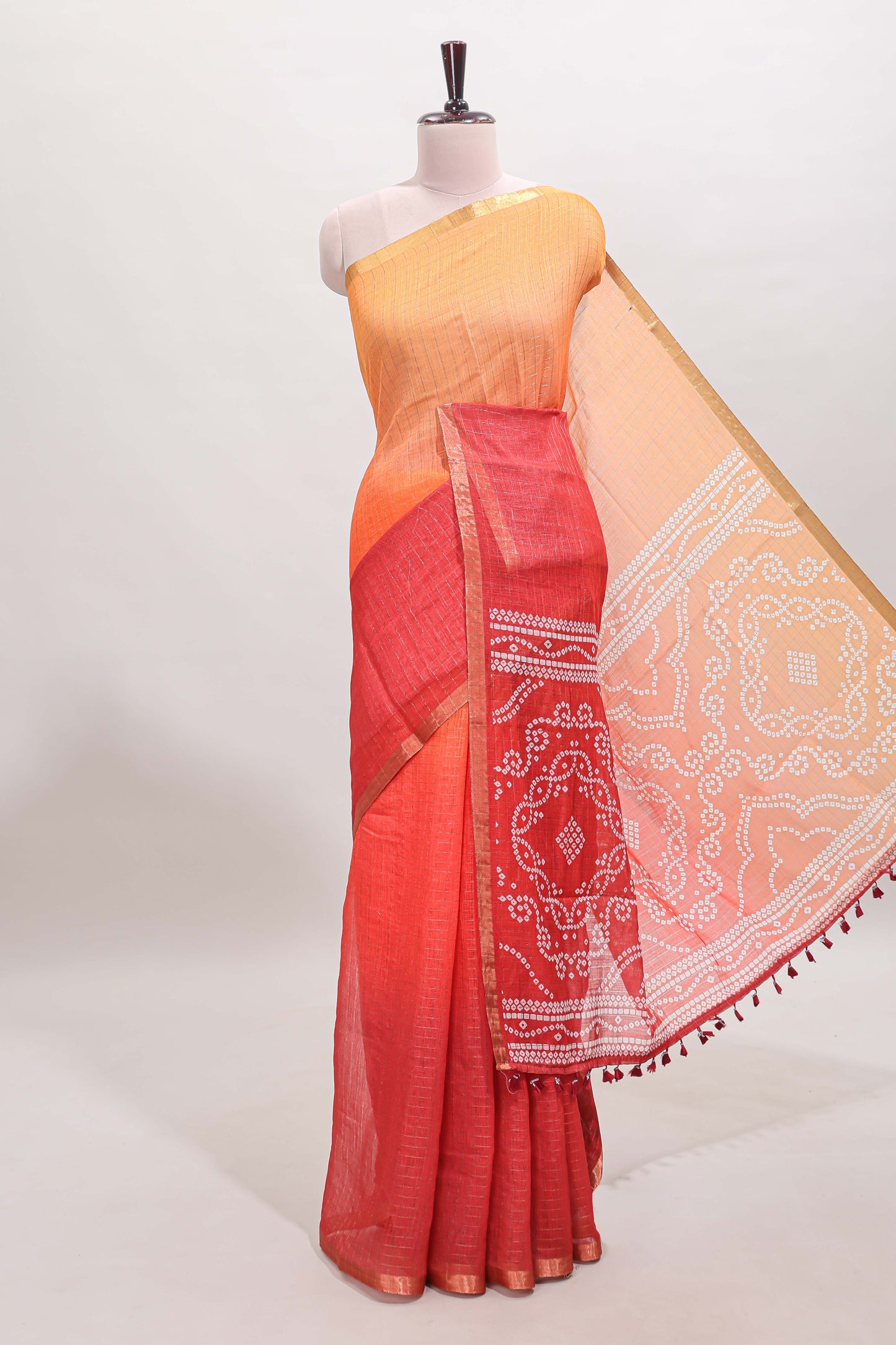 Orange and red dual shade checked checked linen cotton saree with self zari border printed blouse