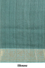 Green ditsy floral print art tussar saree with contrast zari border and matching blouse