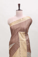 Brown ditsy floral print art tussar saree with contrast zari border and matching blouse