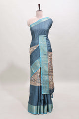 Blue ditsy floral print art tussar saree with contrast zari border and matching blouse