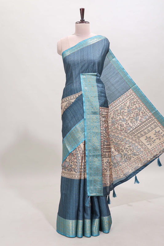 Blue ditsy floral print art tussar saree with contrast zari border and matching blouse