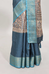 Blue ditsy floral print art tussar saree with contrast zari border and matching blouse