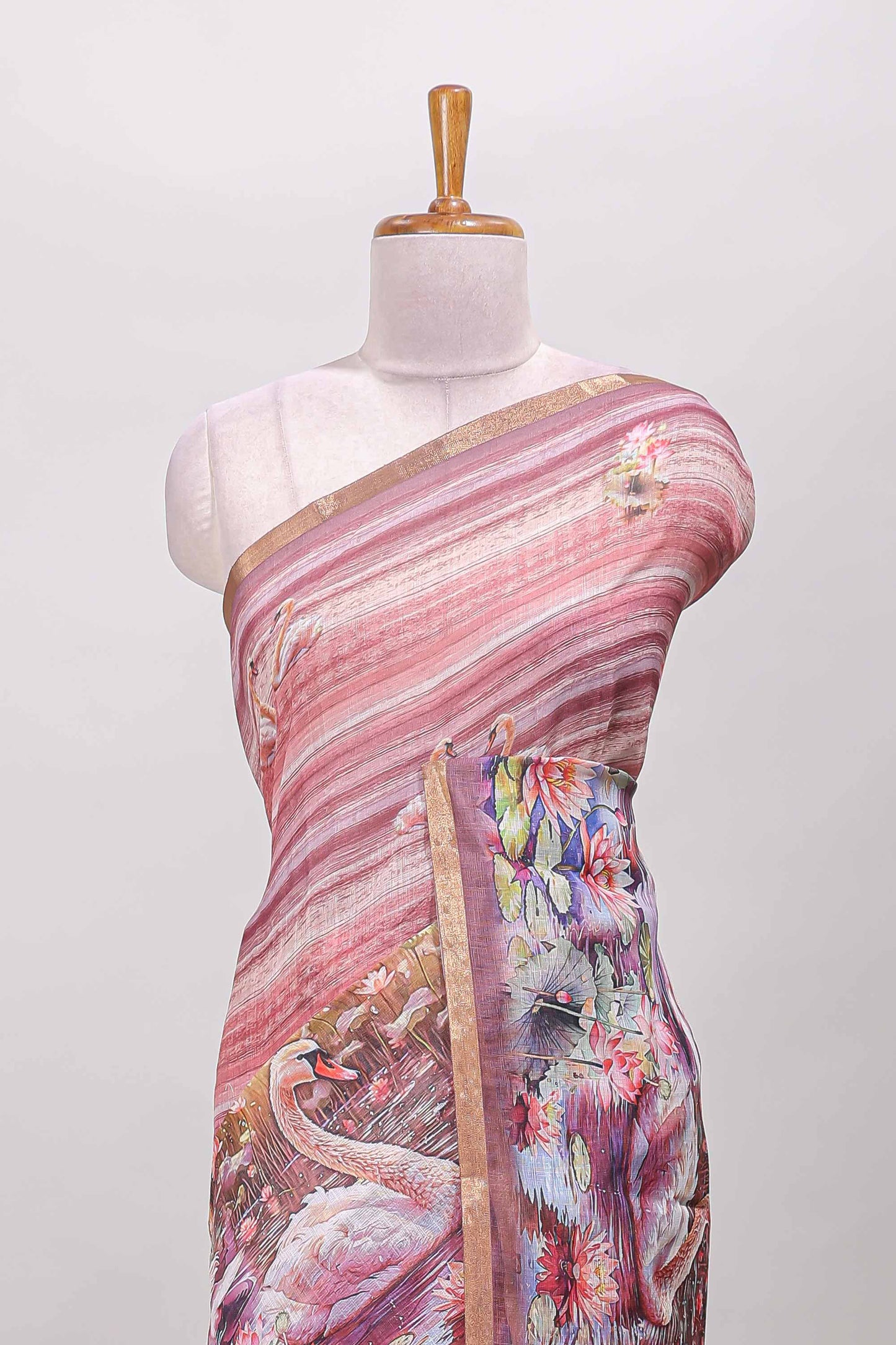 Peach linen cotton saree with swan & lotus pond print, self zari border and matching printed pallu