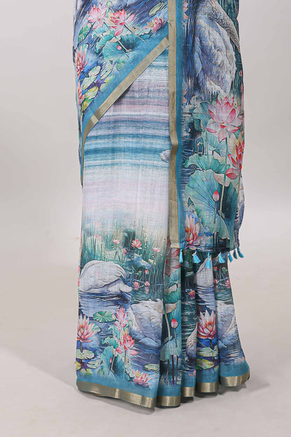 Blue linen cotton saree with swan & lotus pond print, self zari border and matching printed pallu