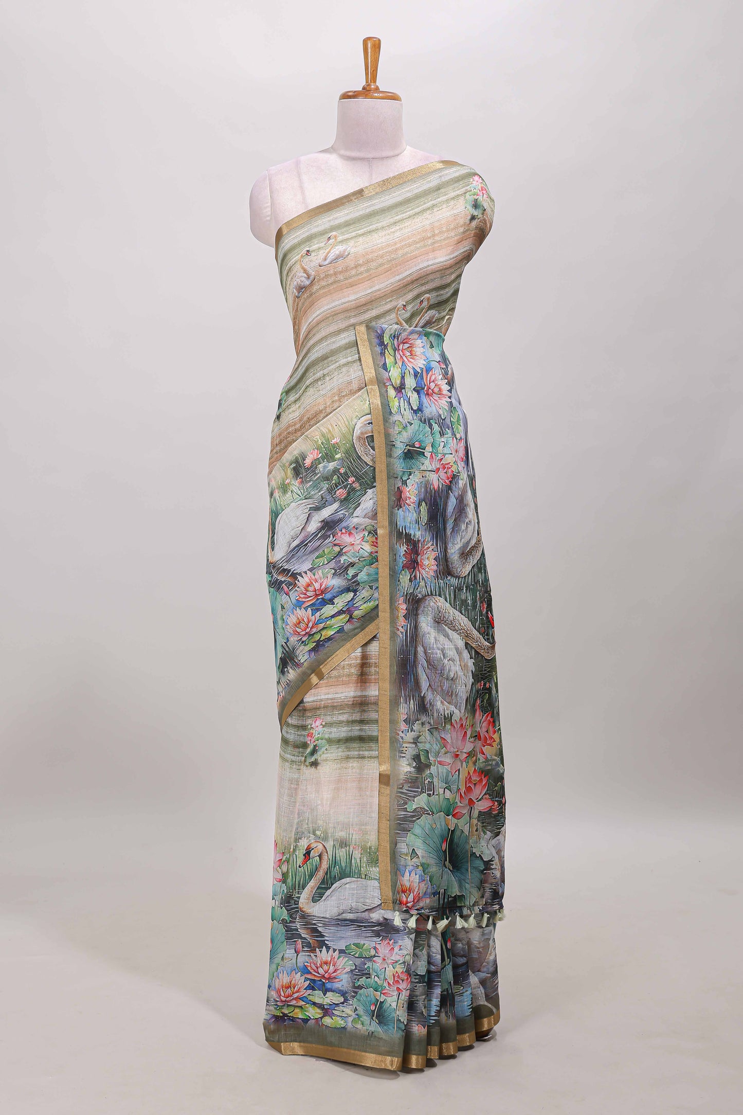 Olive green linen cotton saree with swan & lotus pond print, self zari border and matching printed pallu