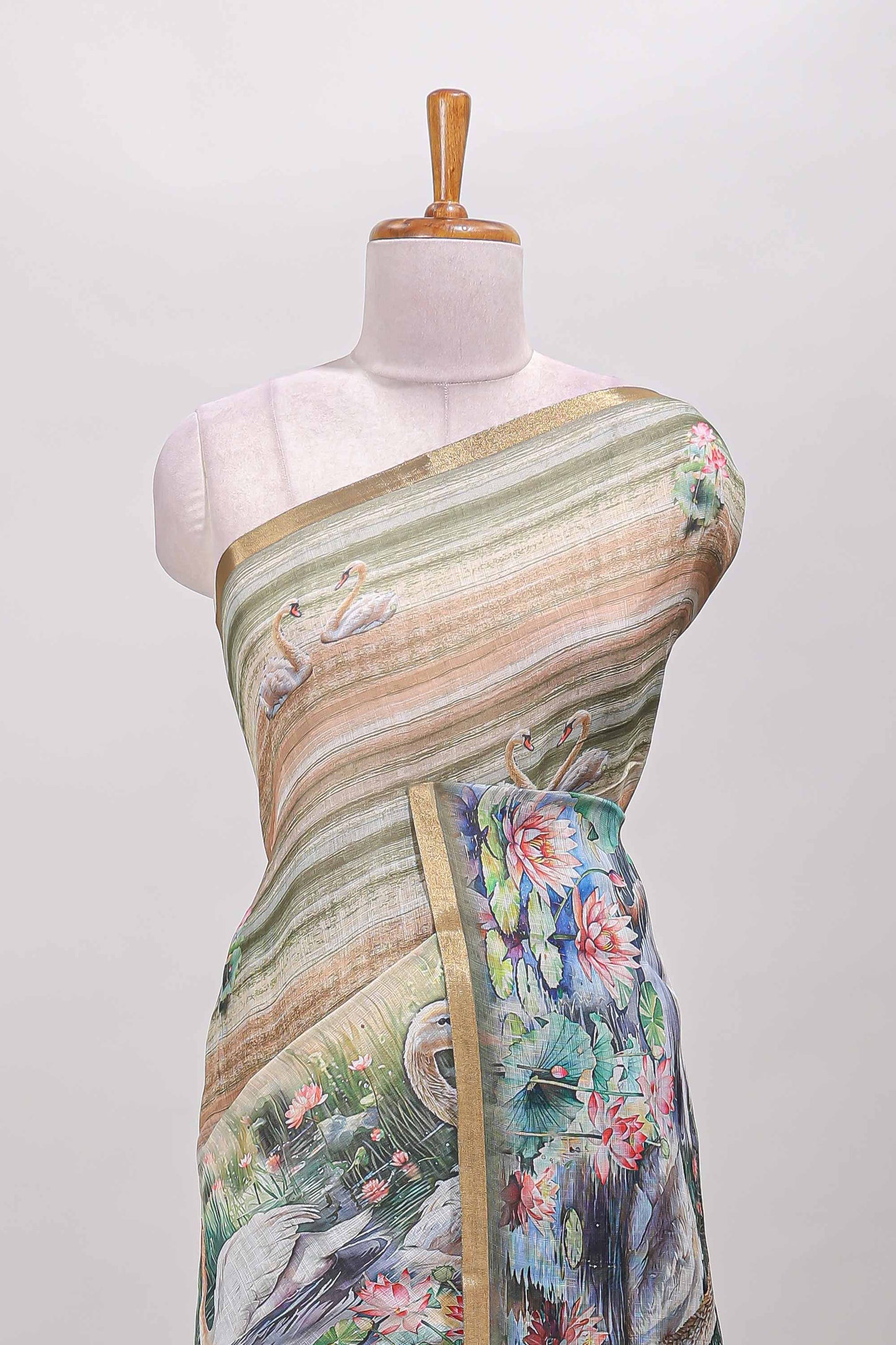 Olive green linen cotton saree with swan & lotus pond print, self zari border and matching printed pallu