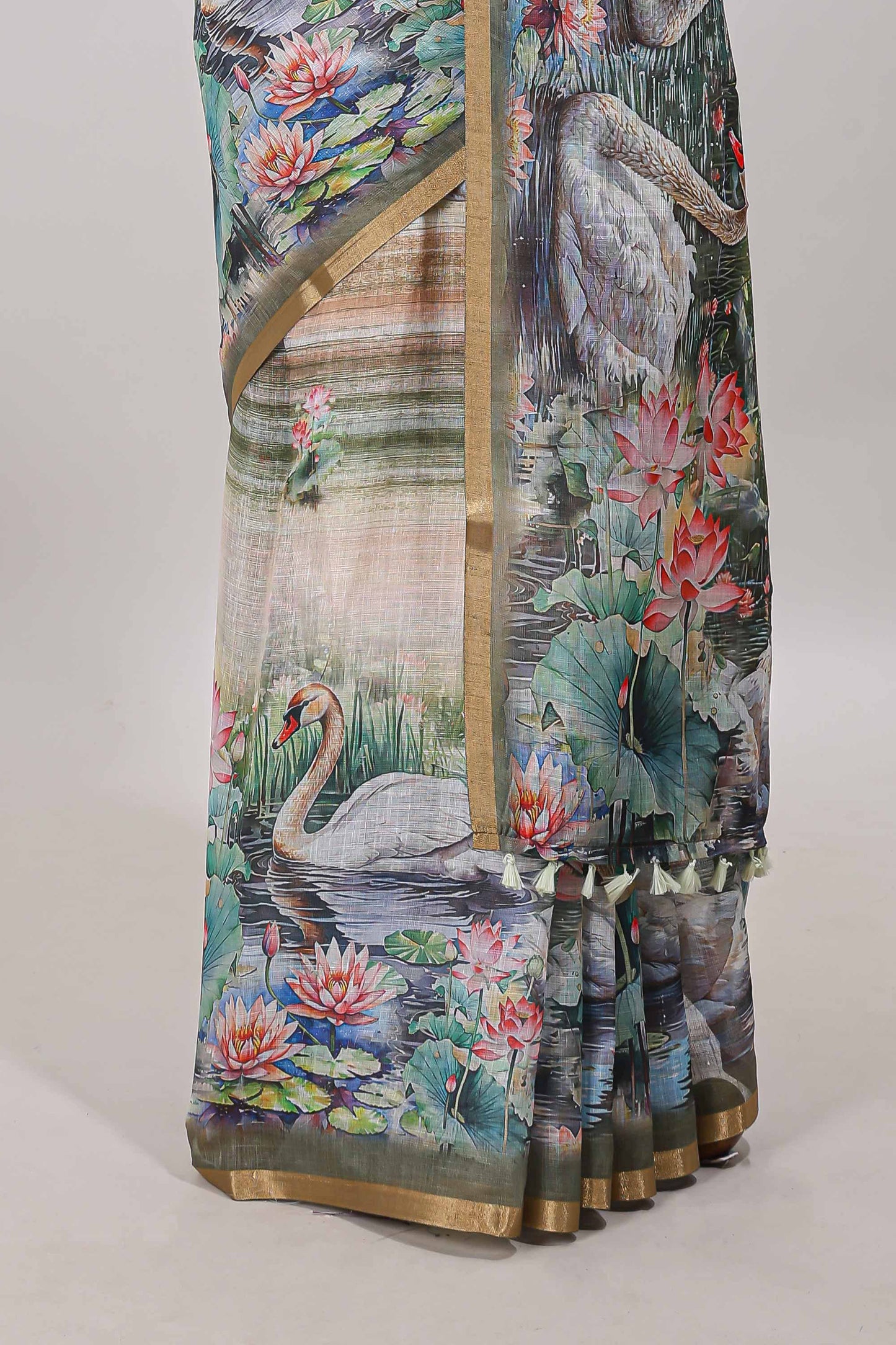 Olive green linen cotton saree with swan & lotus pond print, self zari border and matching printed pallu