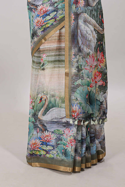 Olive green linen cotton saree with swan & lotus pond print, self zari border and matching printed pallu
