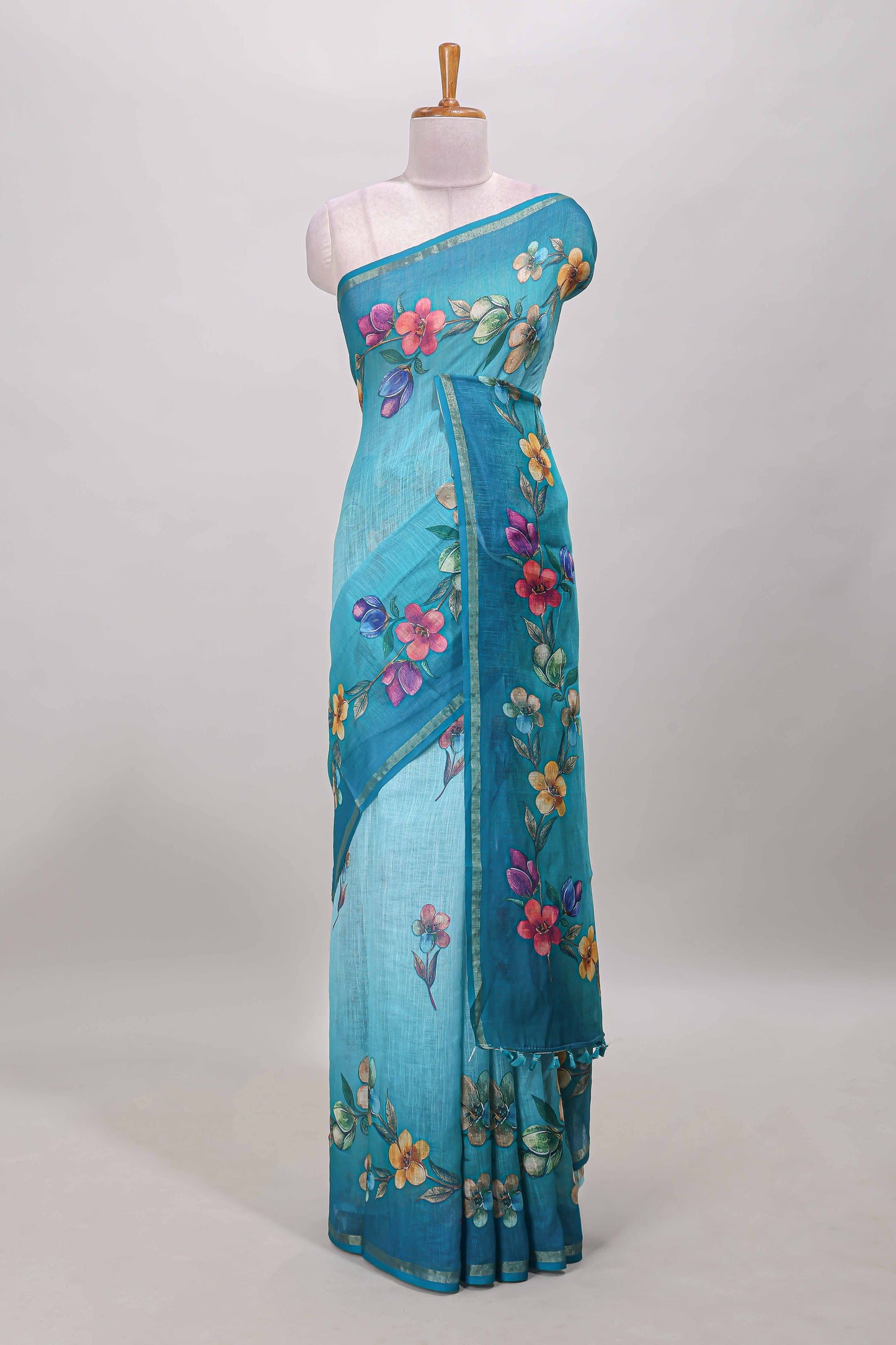 Turquoise green floral vine design linen cotton saree with self zari border and matching printed blouse