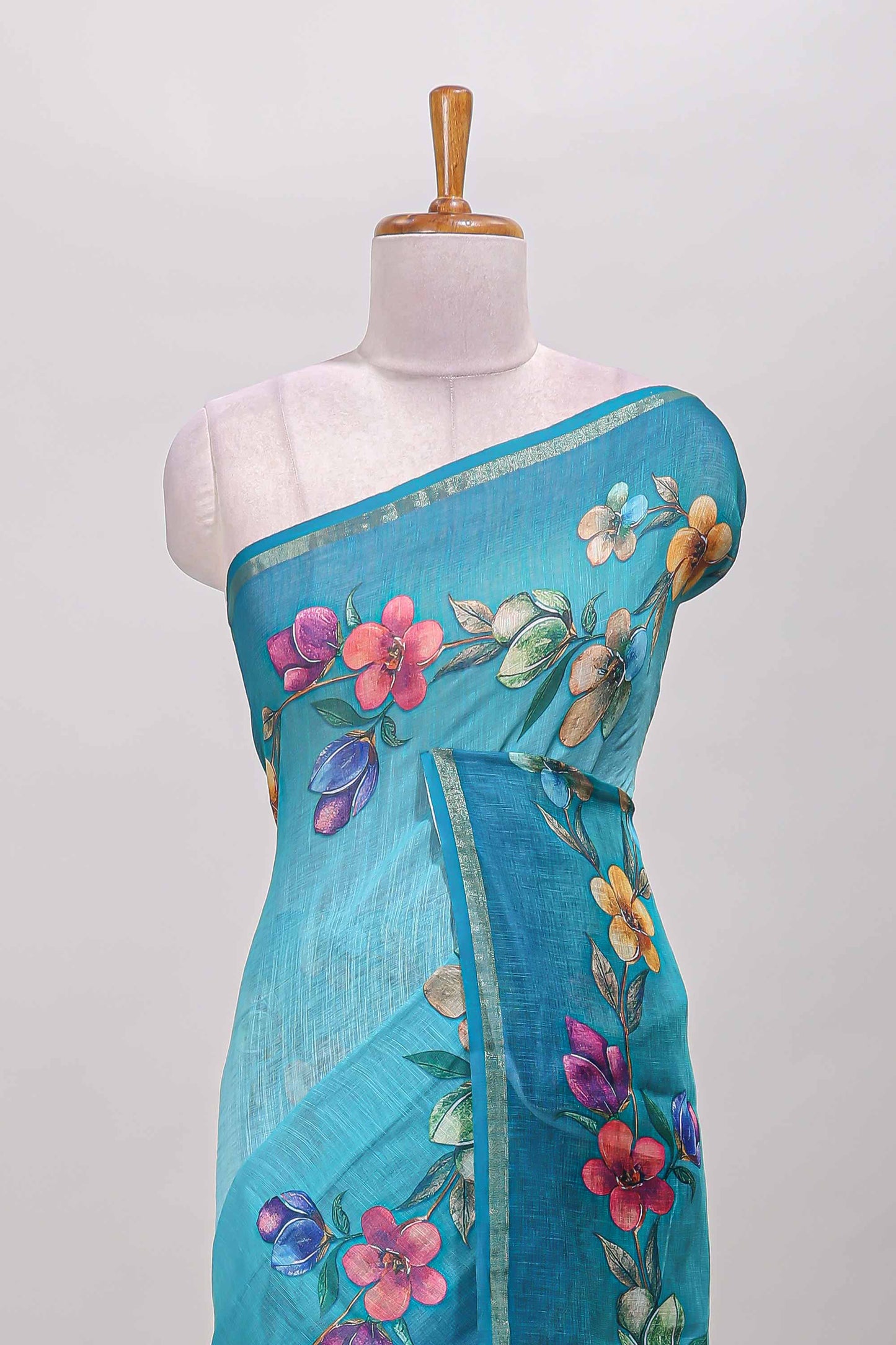 Turquoise green floral vine design linen cotton saree with self zari border and matching printed blouse