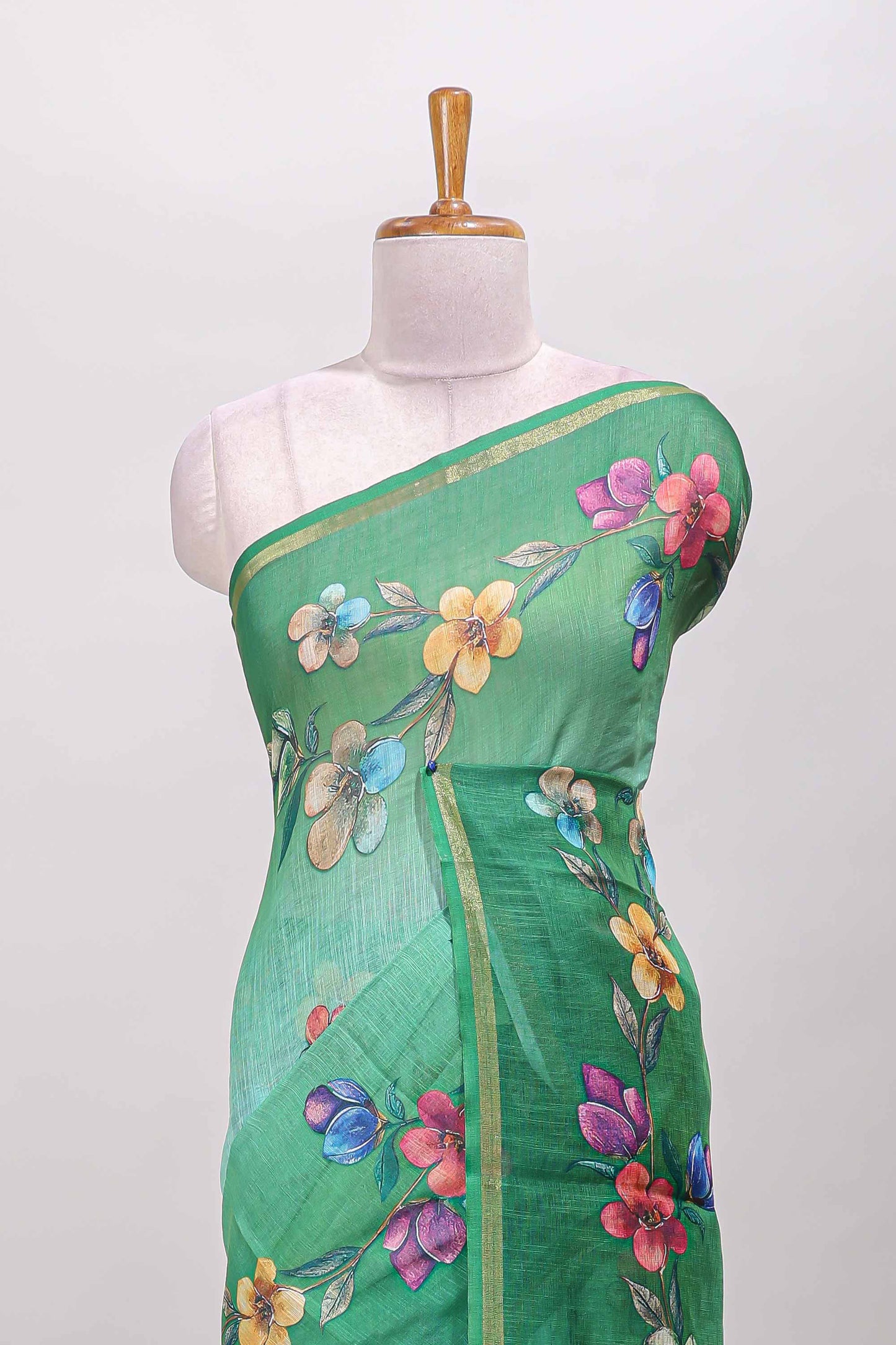 Green floral vine design linen cotton saree with self zari border and matching printed blouse