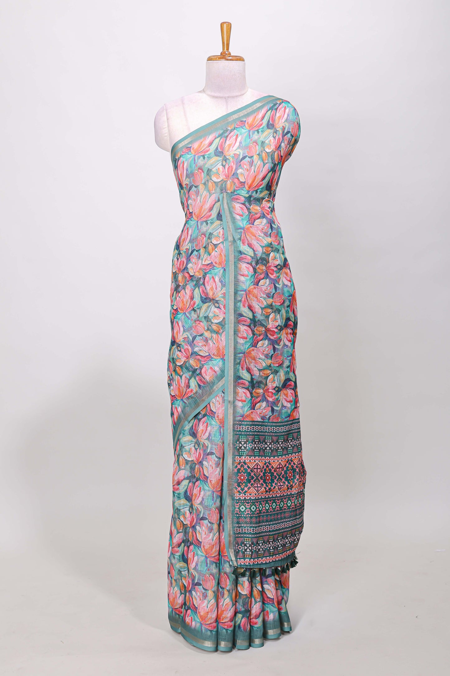 Green linen cotton saree with floral design and Ikkat motif pallu