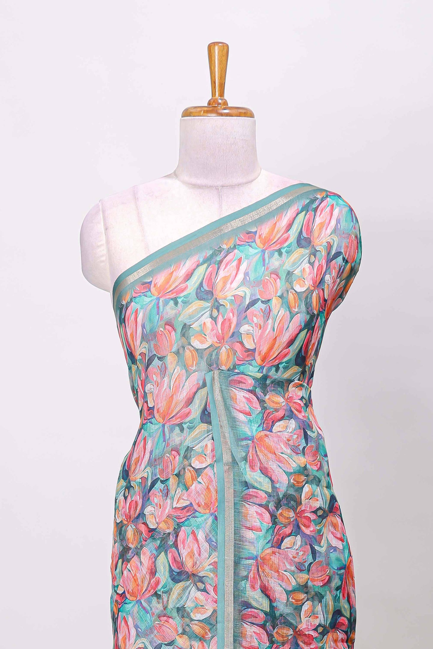 Green linen cotton saree with floral design and Ikkat motif pallu