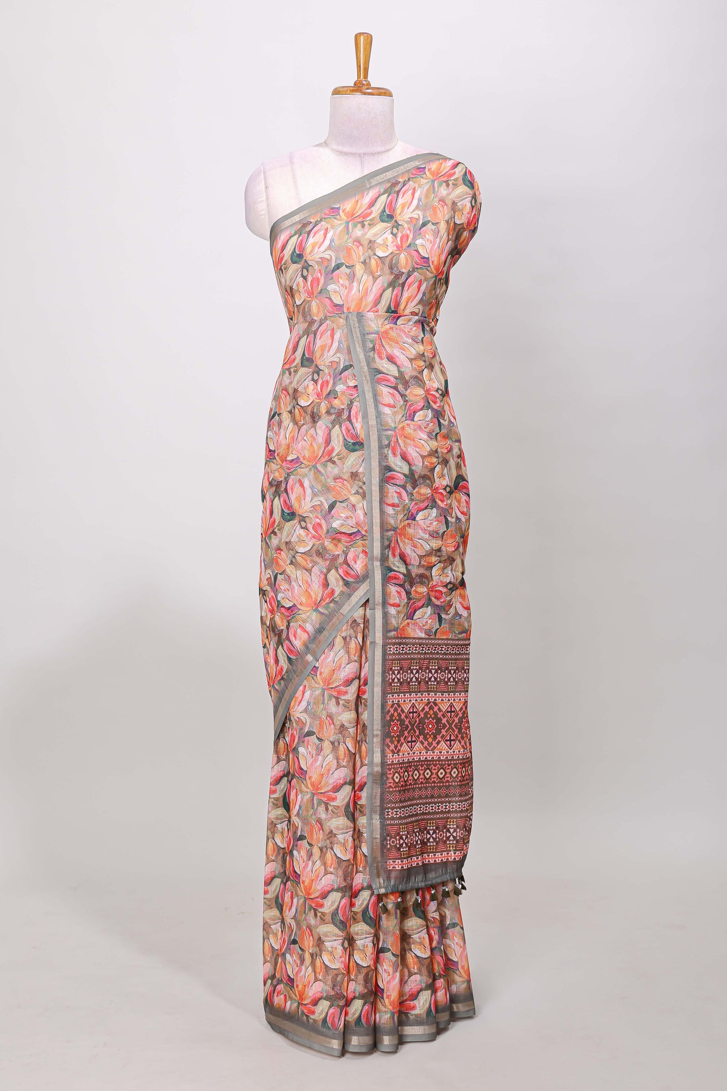 Grey linen cotton saree with floral design and Ikkat motif pallu