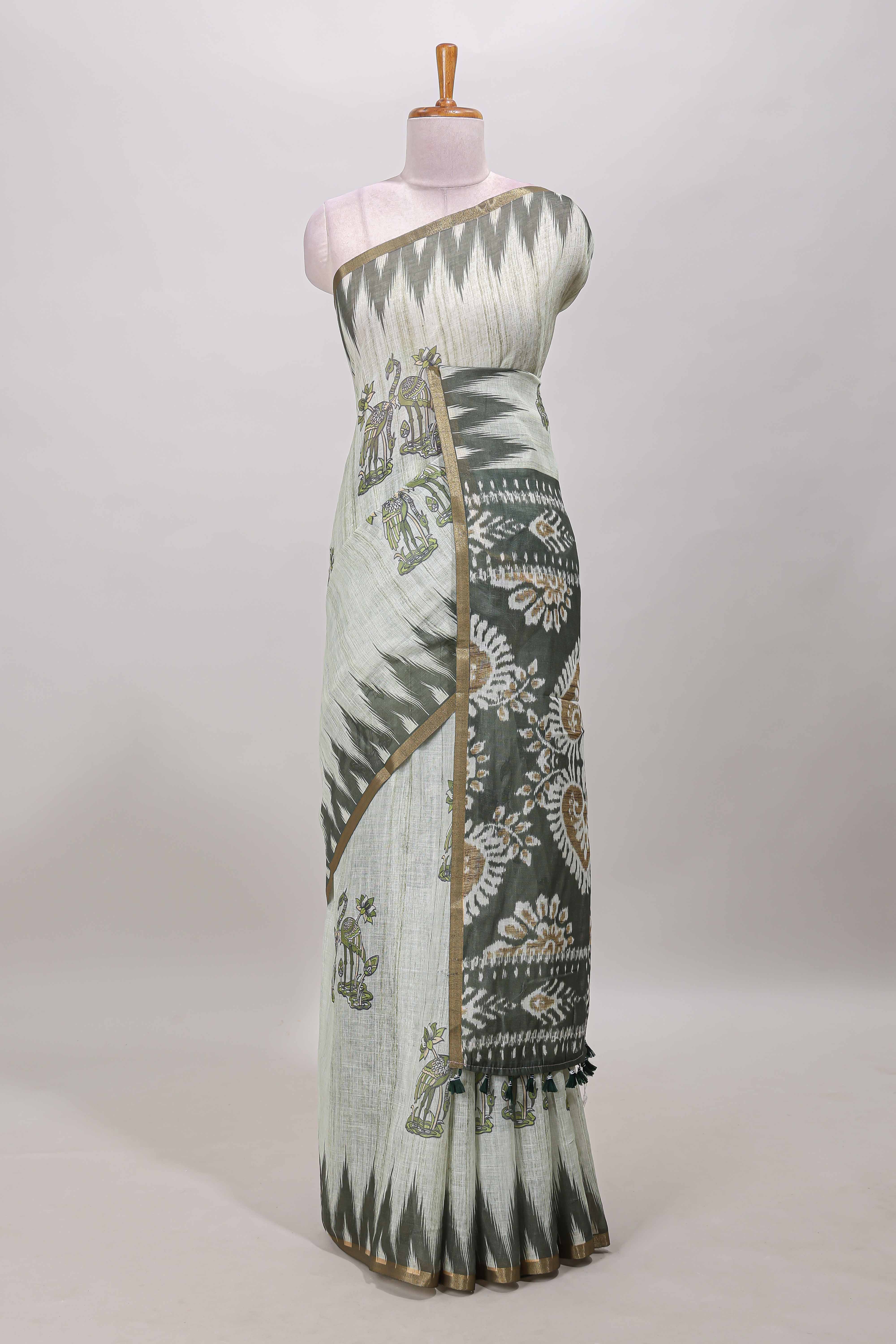 Green lotus and crane birds motis linen cotton saree with ikkat style self zari border and pallu
