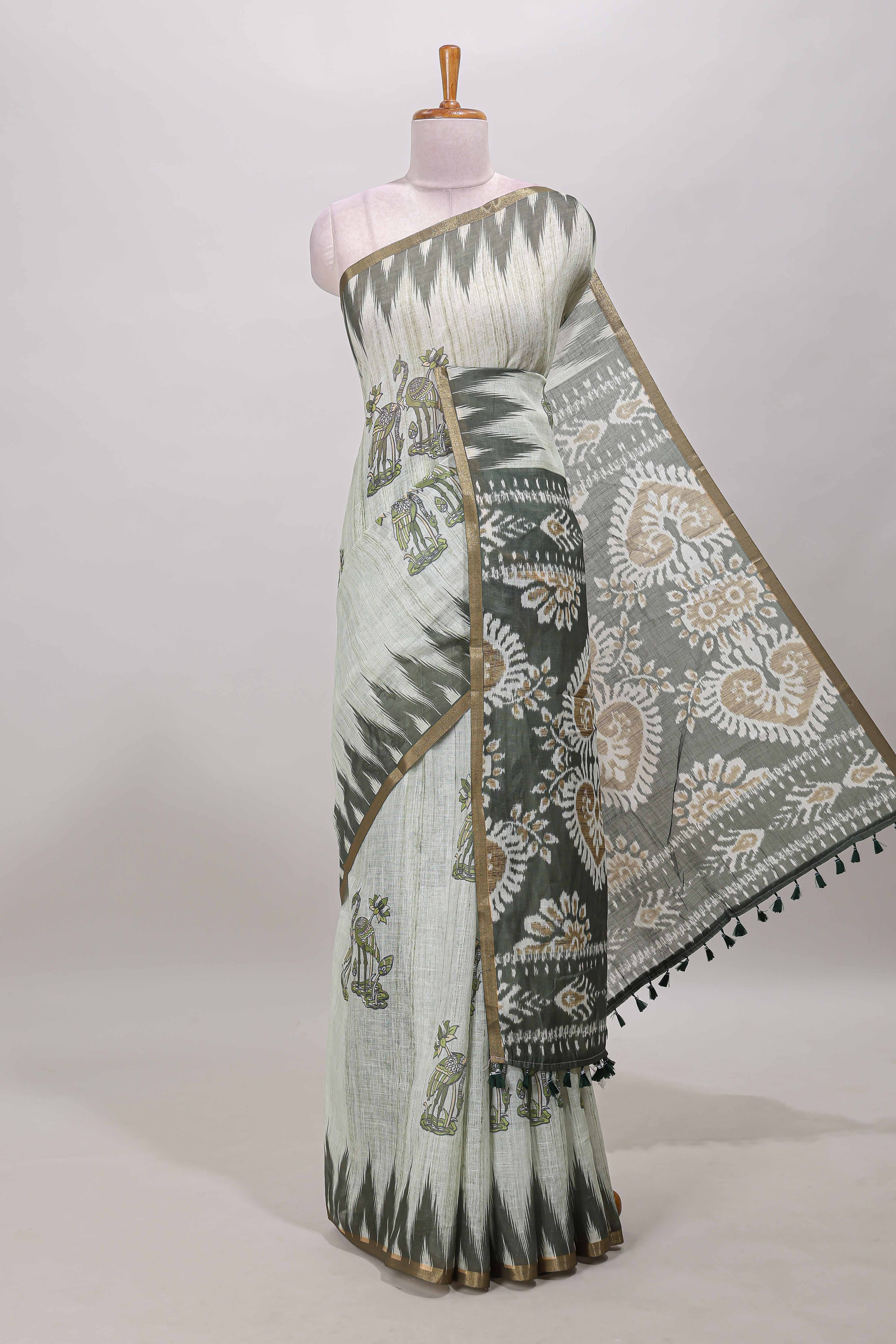 Green lotus and crane birds motis linen cotton saree with ikkat style self zari border and pallu