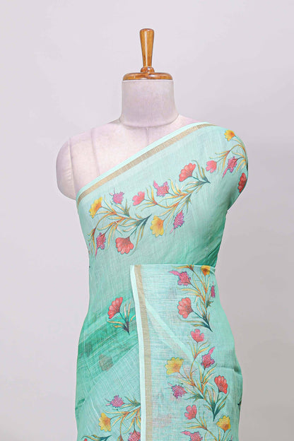 Green linen cotton saree with floral vines print, zari border and printed blouse