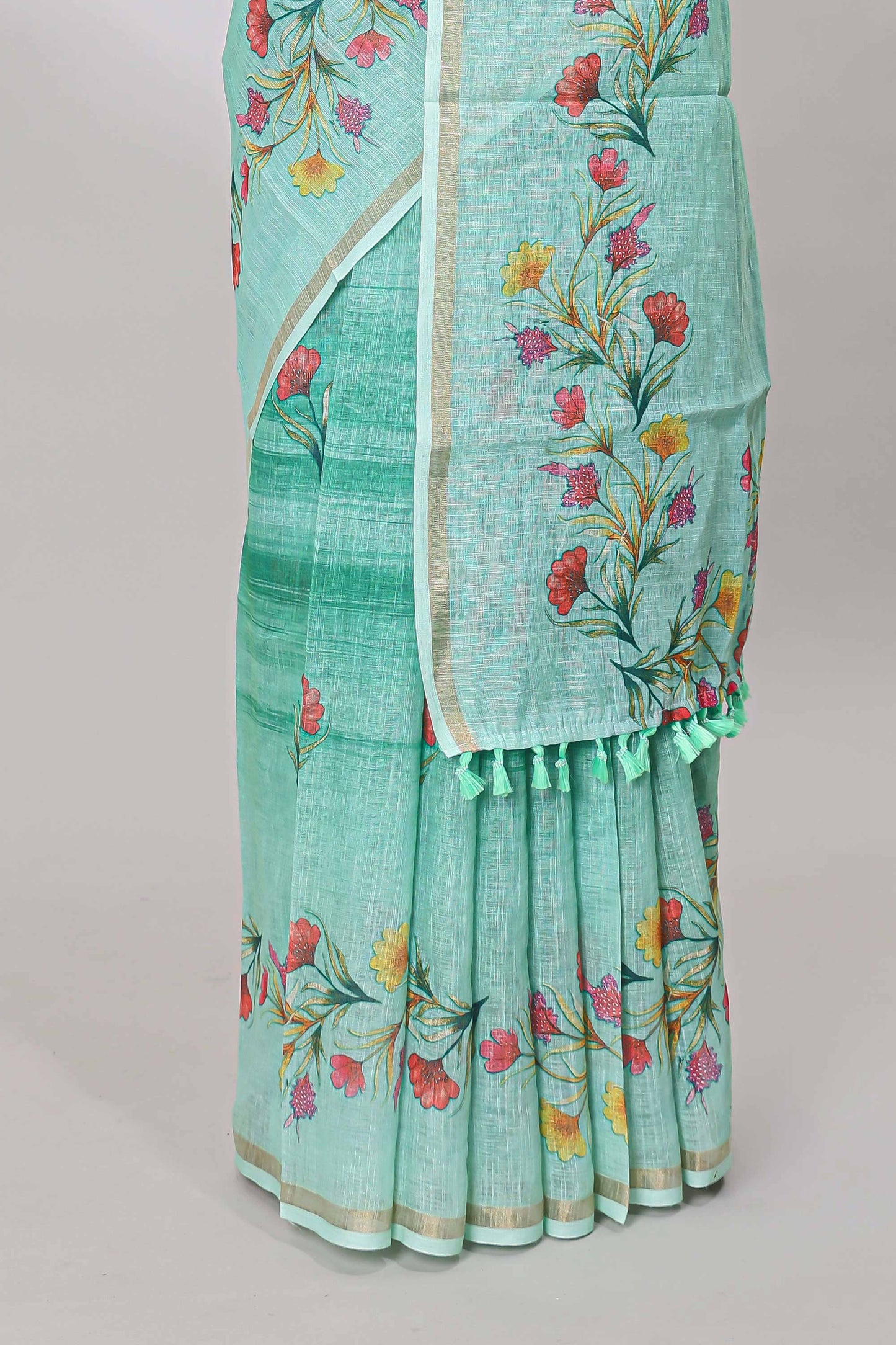 Green linen cotton saree with floral vines print, zari border and printed blouse