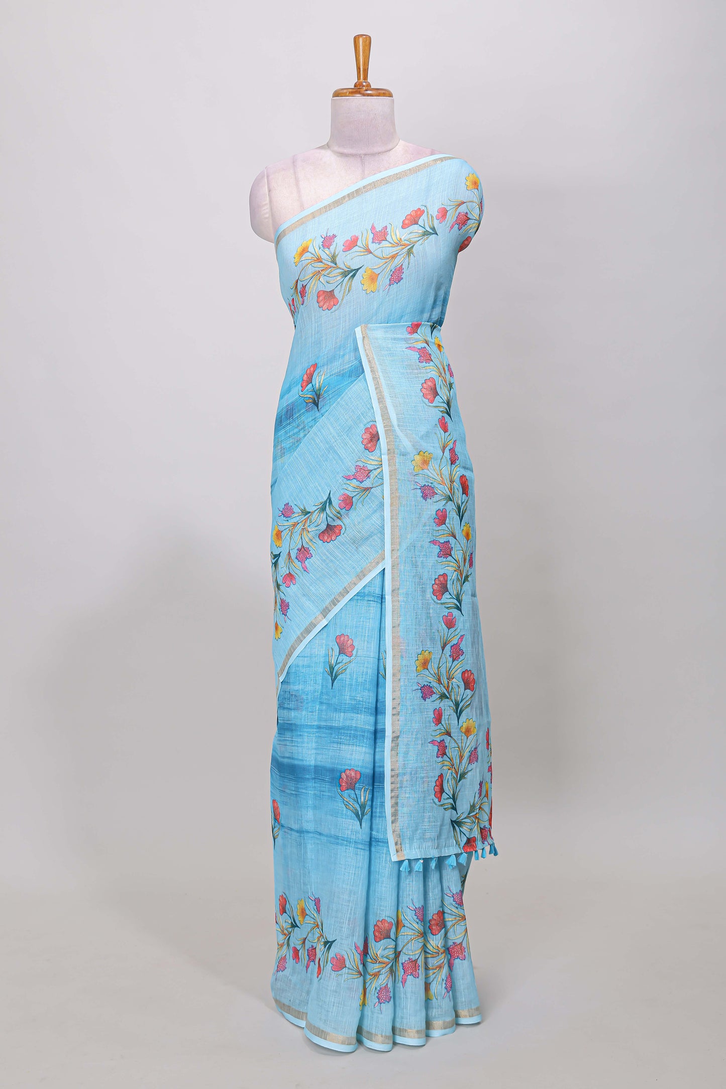 Blue linen cotton saree with floral vines print, zari border and printed blouse