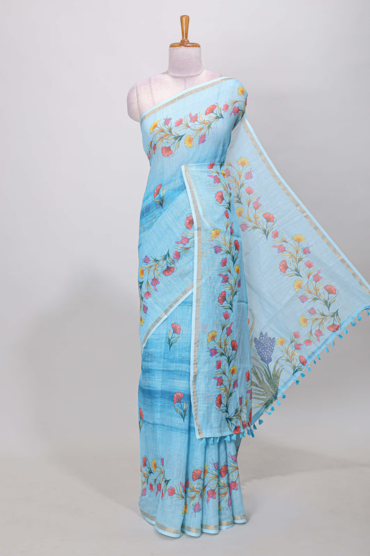 Blue linen cotton saree with floral vines print, zari border and printed blouse