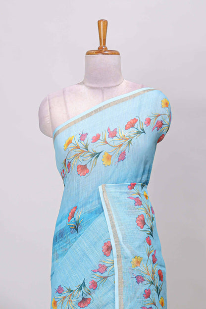 Blue linen cotton saree with floral vines print, zari border and printed blouse