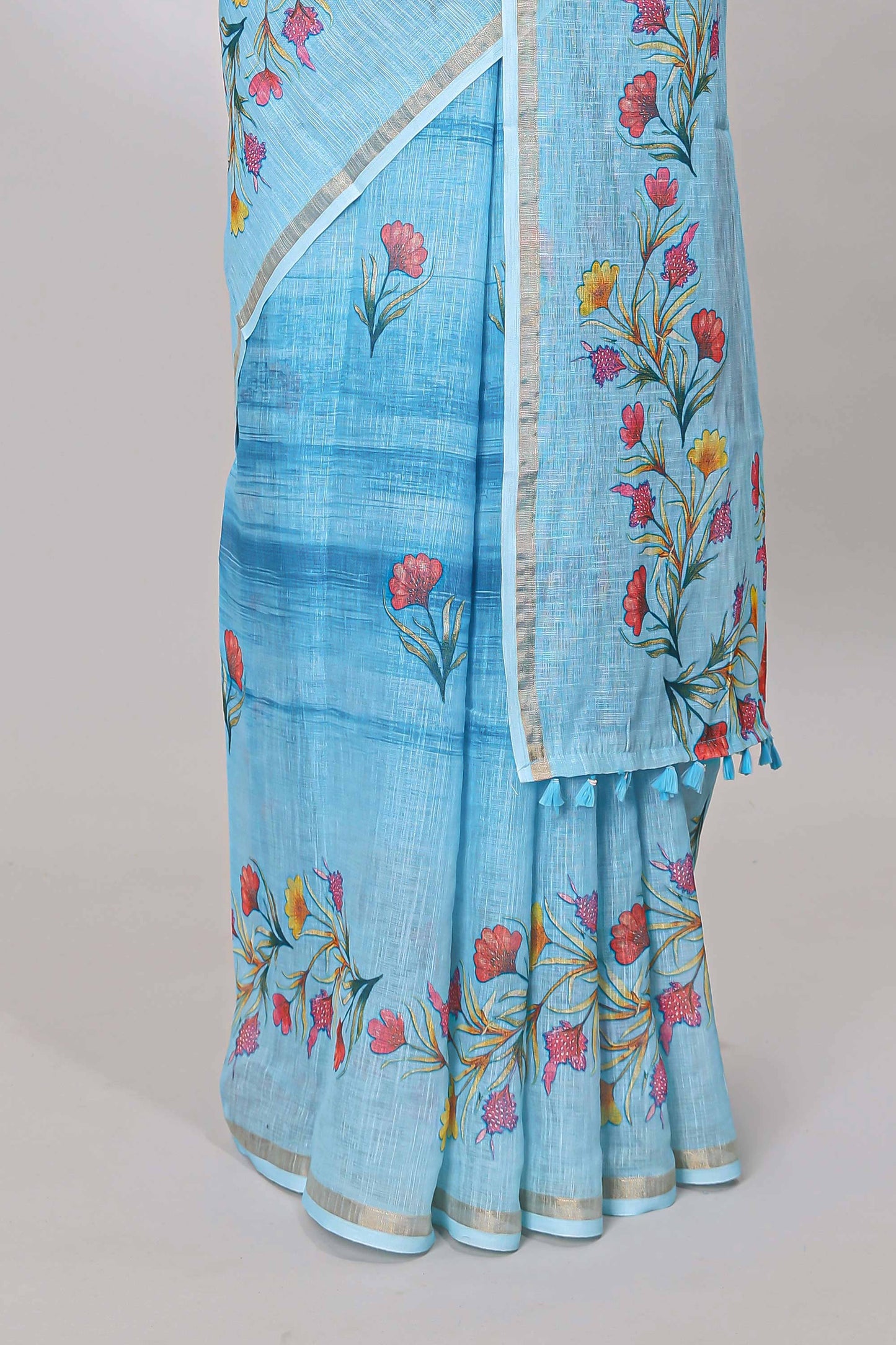 Blue linen cotton saree with floral vines print, zari border and printed blouse