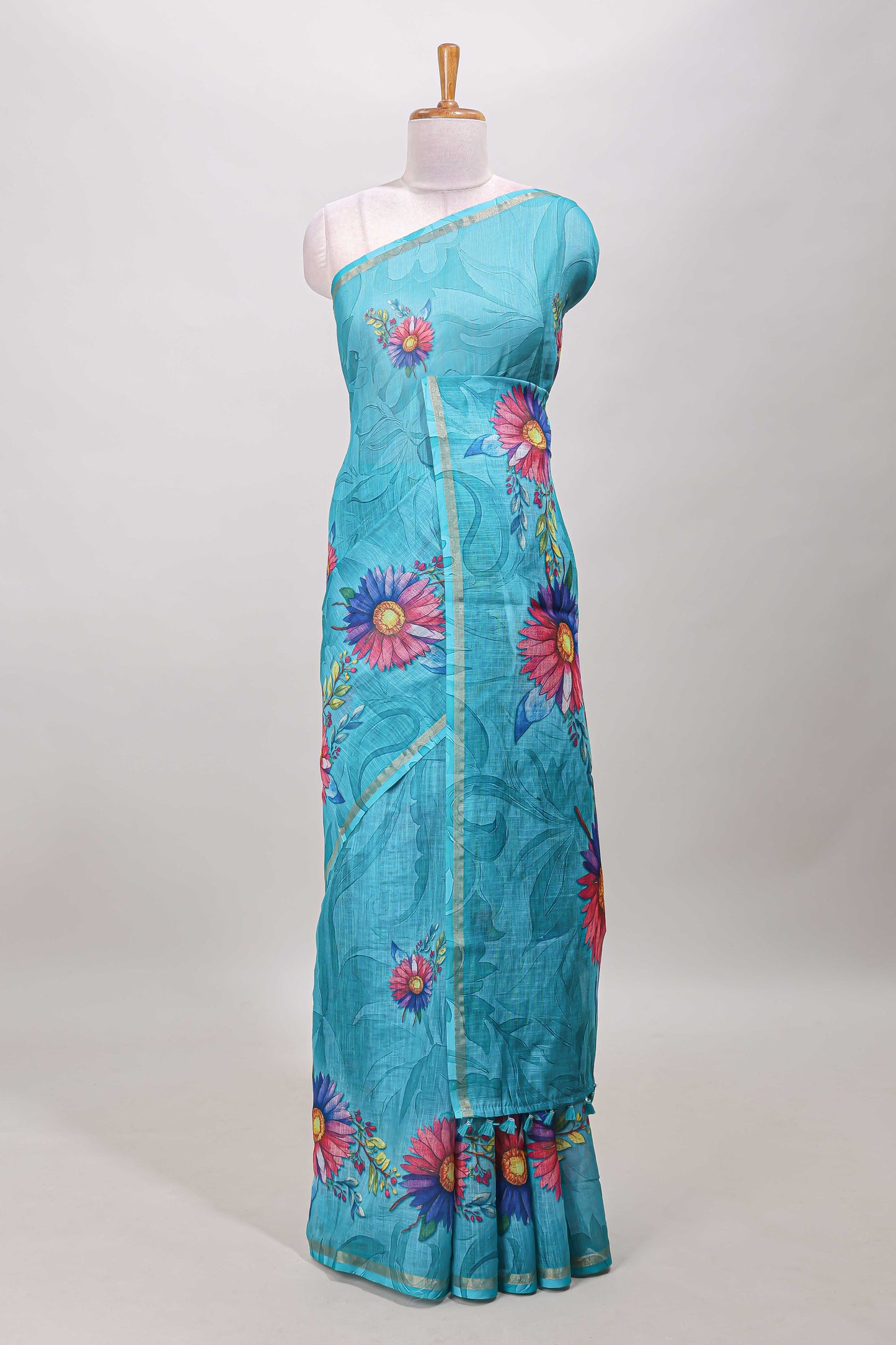 Turquoise green floral print linen cotton saree with self zari border and matching blouse