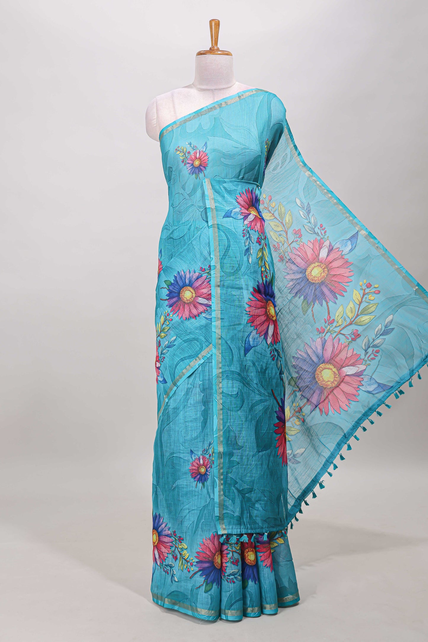 Turquoise green floral print linen cotton saree with self zari border and matching blouse