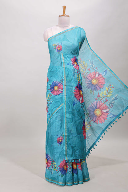 Turquoise green floral print linen cotton saree with self zari border and matching blouse