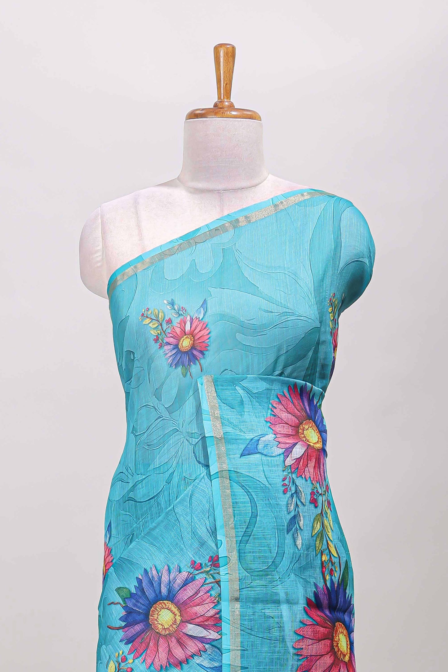 Turquoise green floral print linen cotton saree with self zari border and matching blouse