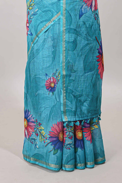 Turquoise green floral print linen cotton saree with self zari border and matching blouse