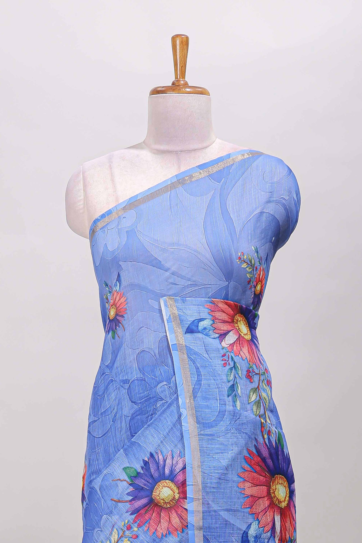 Blue floral print linen cotton saree with self zari border and matching blouse