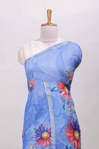 Blue floral print linen cotton saree with self zari border and matching blouse