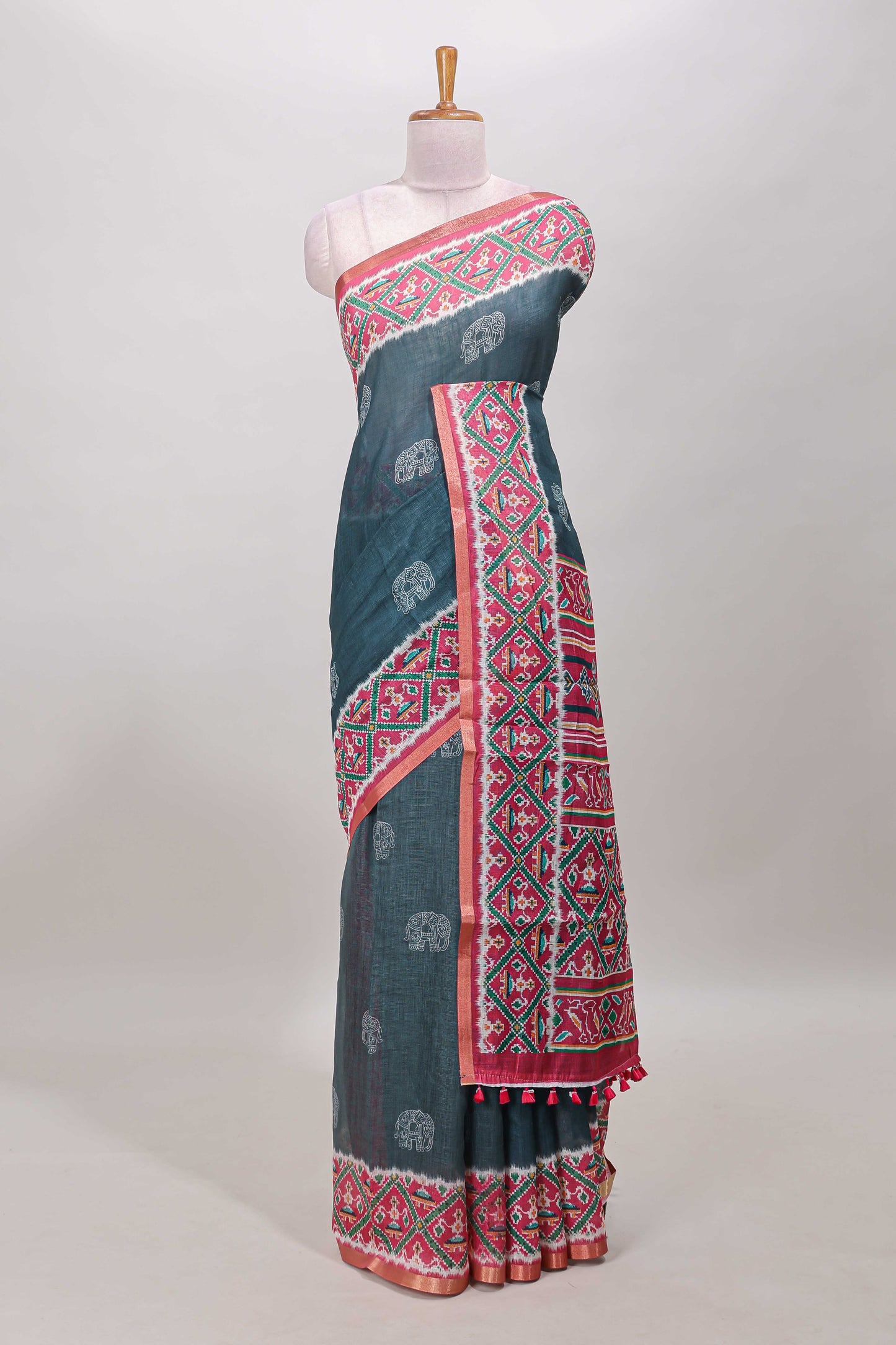 Green elephant motifs linen cotton saree with contrast ikkat style border and printed blouse