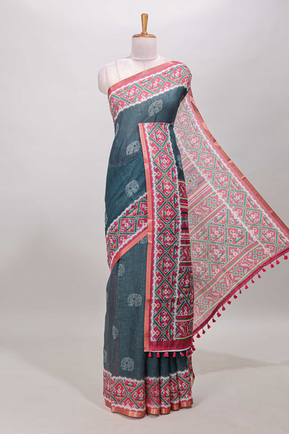 Green elephant motifs linen cotton saree with contrast ikkat style border and printed blouse