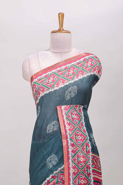 Green elephant motifs linen cotton saree with contrast ikkat style border and printed blouse