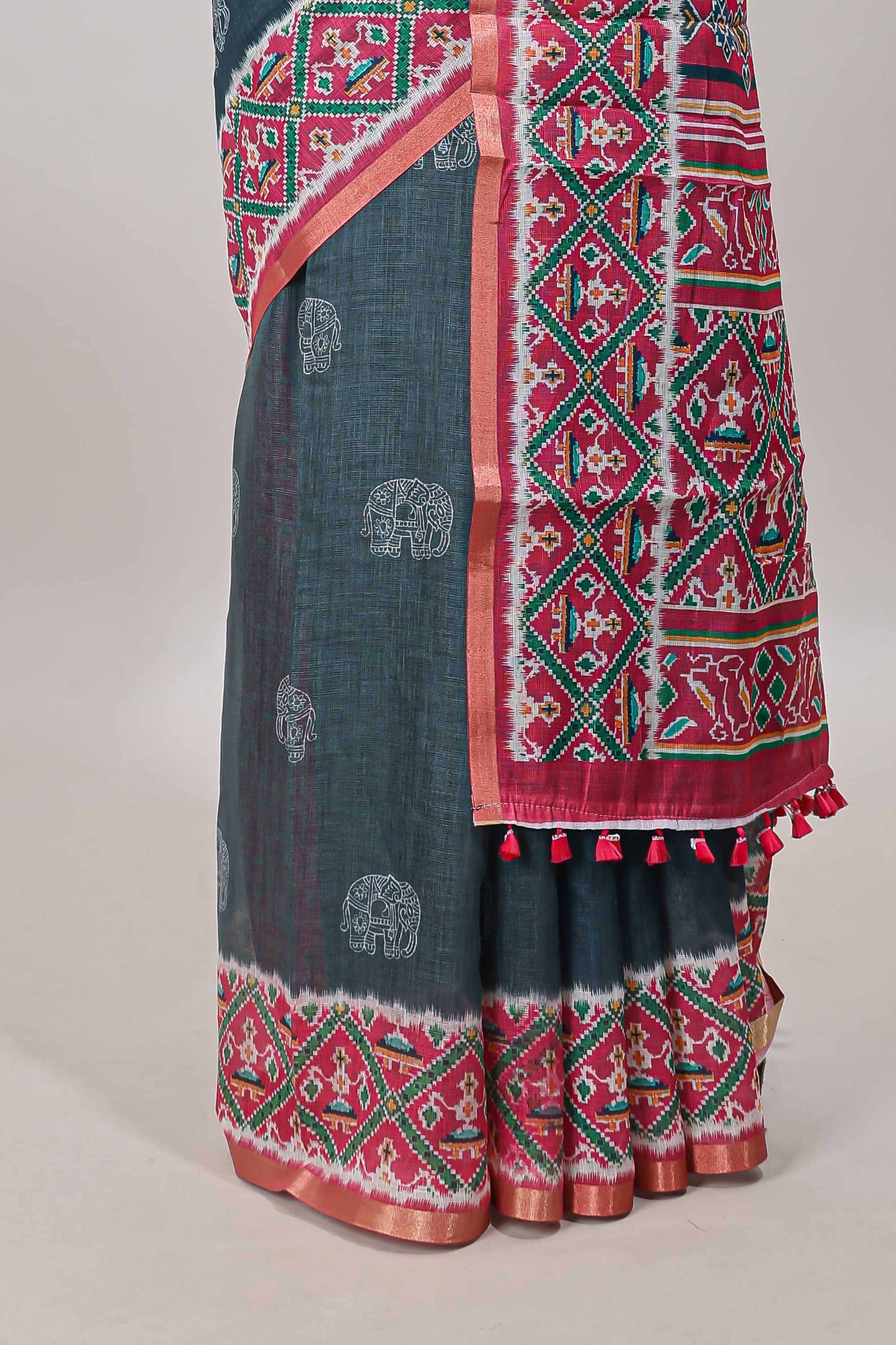 Green elephant motifs linen cotton saree with contrast ikkat style border and printed blouse