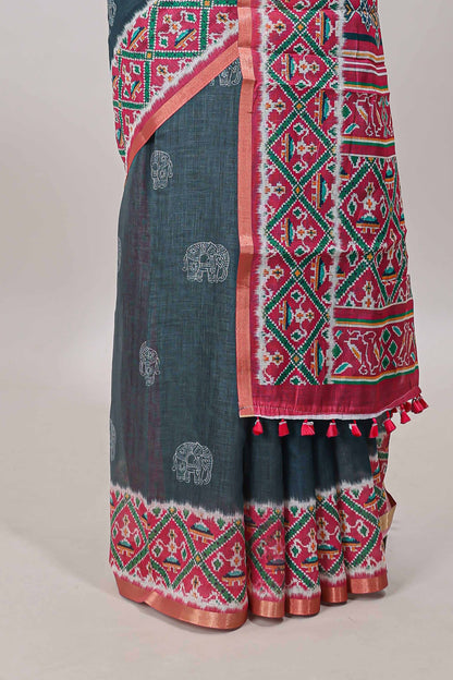Green elephant motifs linen cotton saree with contrast ikkat style border and printed blouse