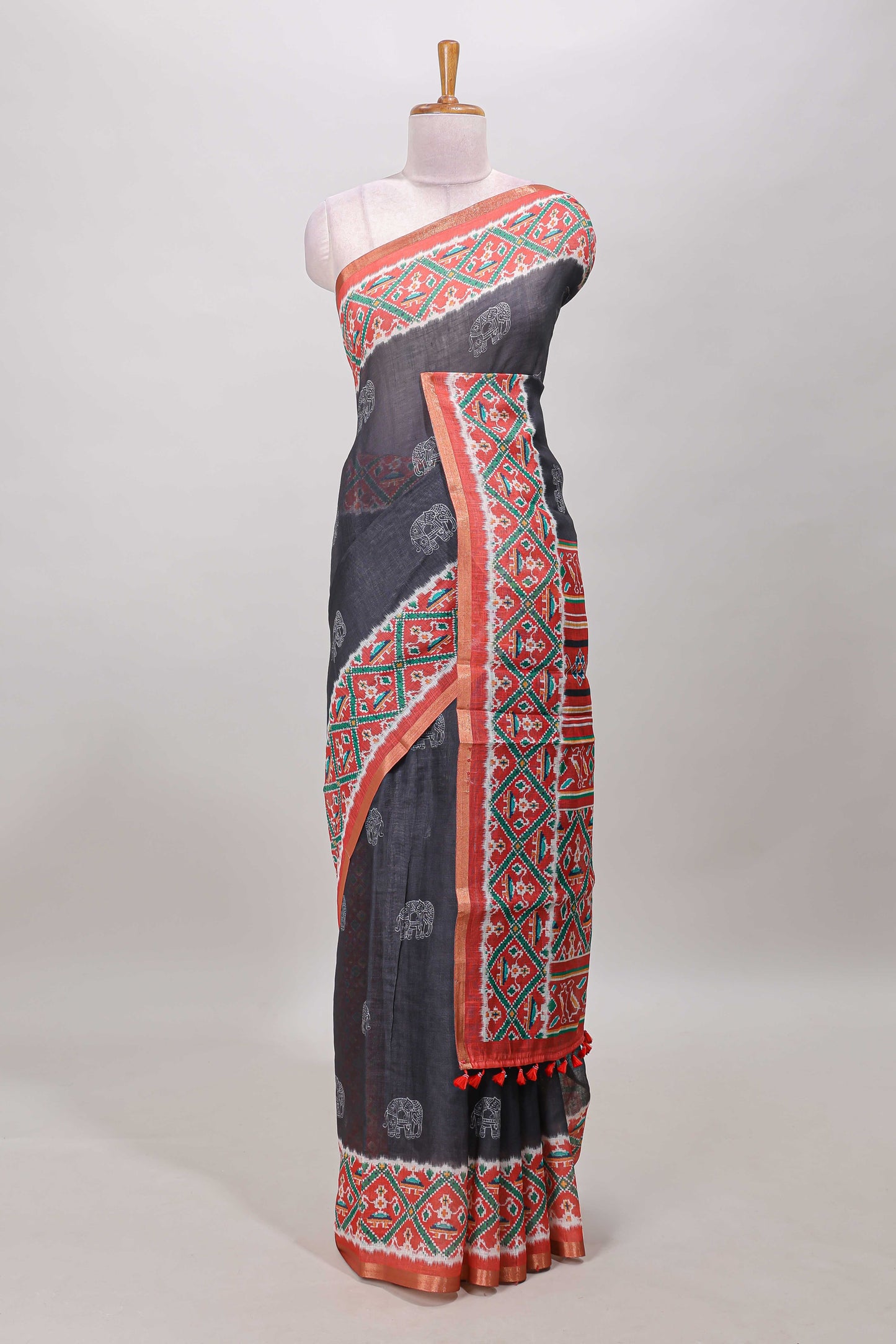 Black elephant motifs linen cotton saree with contrast ikkat style border and printed blouse