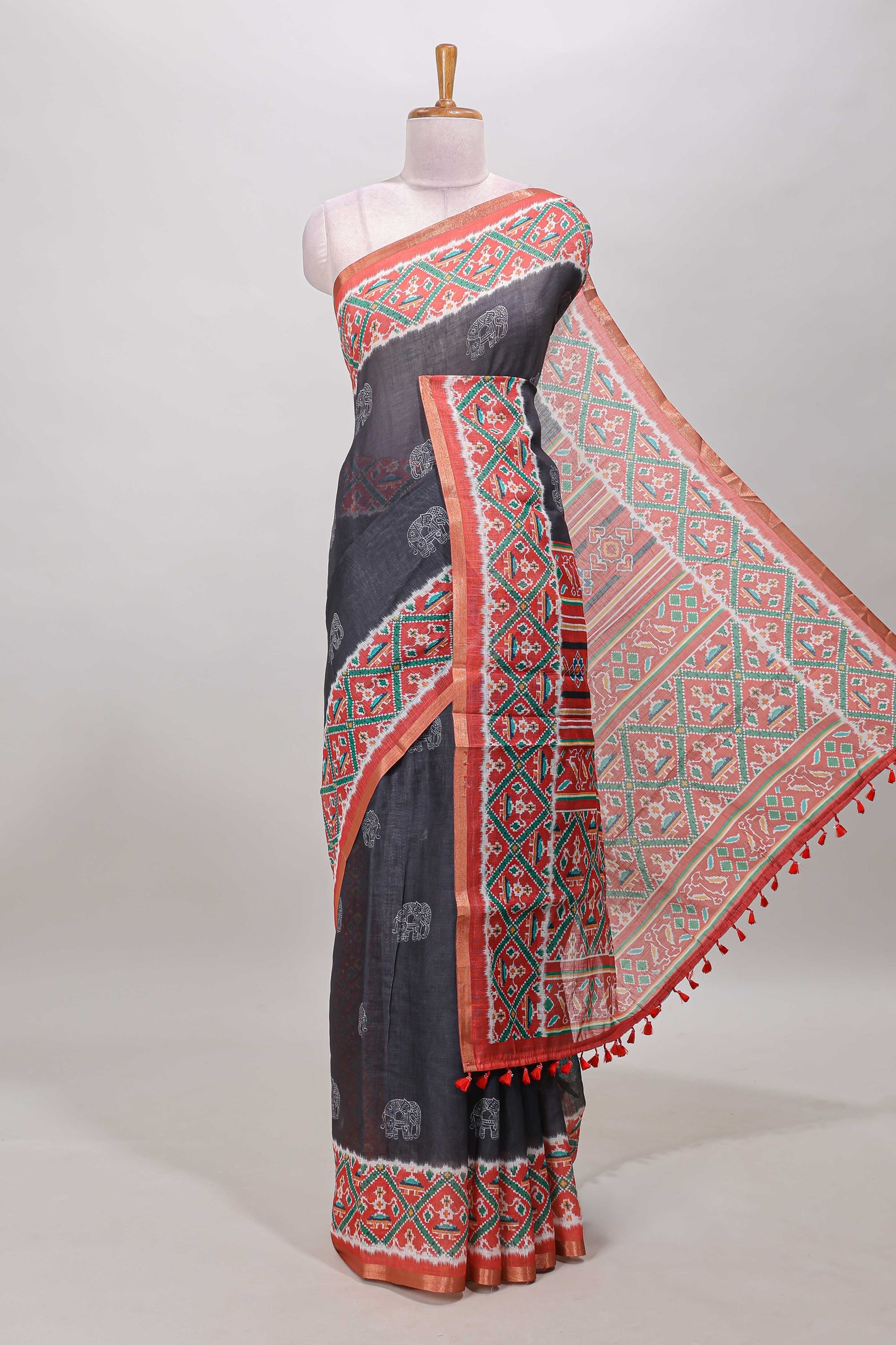 Black elephant motifs linen cotton saree with contrast ikkat style border and printed blouse